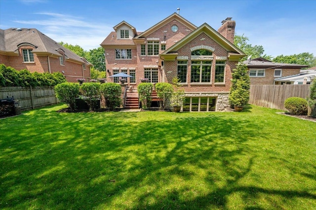 320 Vista Dr, Wilmette, IL 60091 - back of property with brick siding, a wooden deck, and a chimney