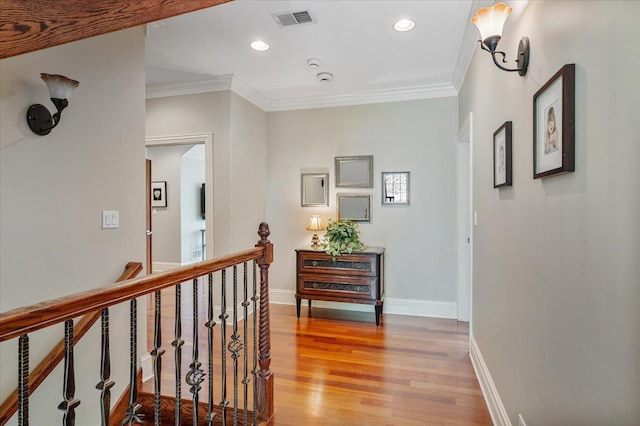 320 Vista Dr, Wilmette, IL 60091 - hall with light wood-type flooring, crown molding, recessed lighting, and an upstairs landing