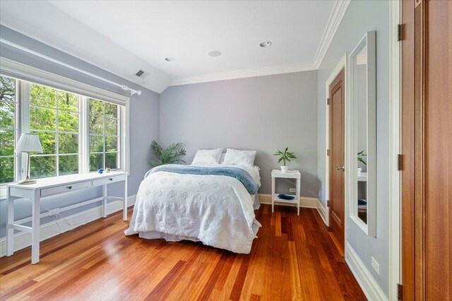 320 Vista Dr, Wilmette, IL 60091 - bedroom featuring wood finished floors and ornamental molding