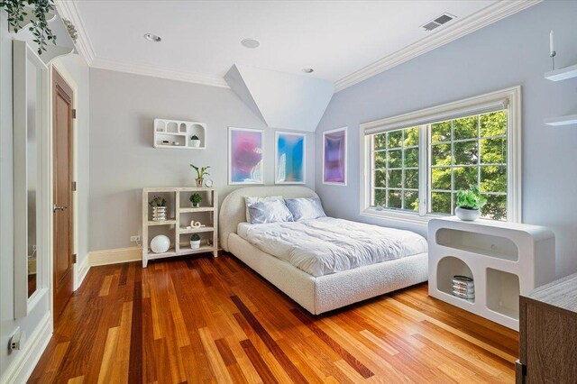 320 Vista Dr, Wilmette, IL 60091 - bedroom featuring wood finished floors and crown molding