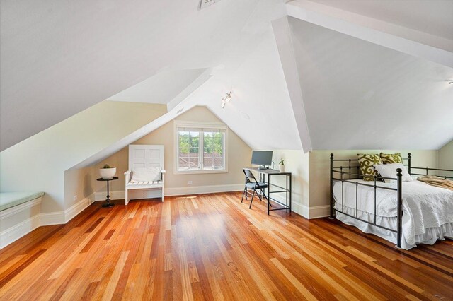320 Vista Dr, Wilmette, IL 60091 - bedroom with wood finished floors and lofted ceiling