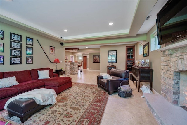 320 Vista Dr, Wilmette, IL 60091 - tiled living area with a fireplace, recessed lighting, and a tray ceiling