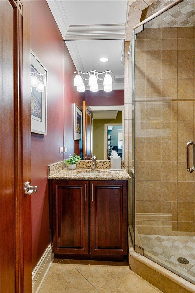 320 Vista Dr, Wilmette, IL 60091 - bathroom with ornamental molding, vanity, tile patterned floors, and a stall shower