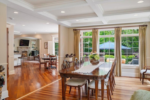 320 Vista Dr, Wilmette, IL 60091 - dining space with a fireplace, coffered ceiling, light wood finished floors, beam ceiling, and ornamental molding