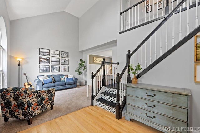 0S587 Grengs Ln, Geneva, IL 60134 - carpeted living area with high vaulted ceiling, stairway, and wood finished floors