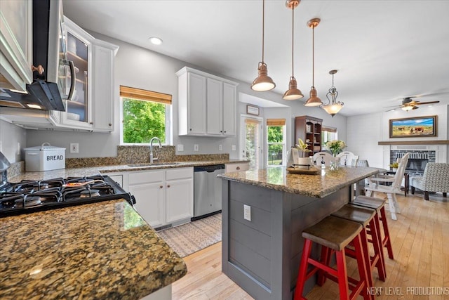 0S587 Grengs Ln, Geneva, IL 60134 - kitchen with stainless steel dishwasher, plenty of natural light, a kitchen breakfast bar, ceiling fan, and recessed lighting
