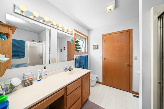 2365 Richardson Rd, West Brooklyn, IL 61378 - full bath featuring vanity, a stall shower, tile patterned floors, and baseboards