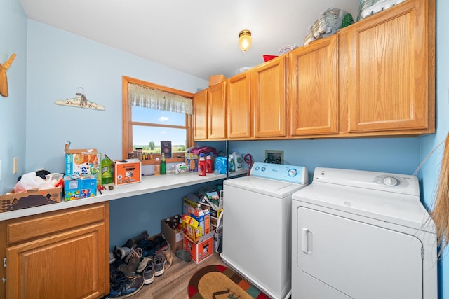 2365 Richardson Rd, West Brooklyn, IL 61378 - laundry room with cabinet space, washing machine and dryer, and wood finished floors