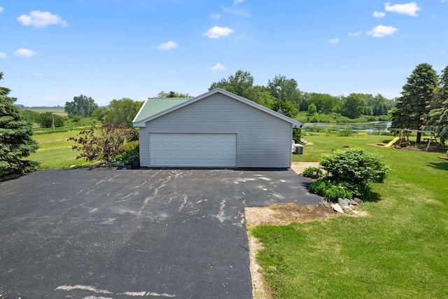2365 Richardson Rd, West Brooklyn, IL 61378 - detached garage with a water view and view of wooded area