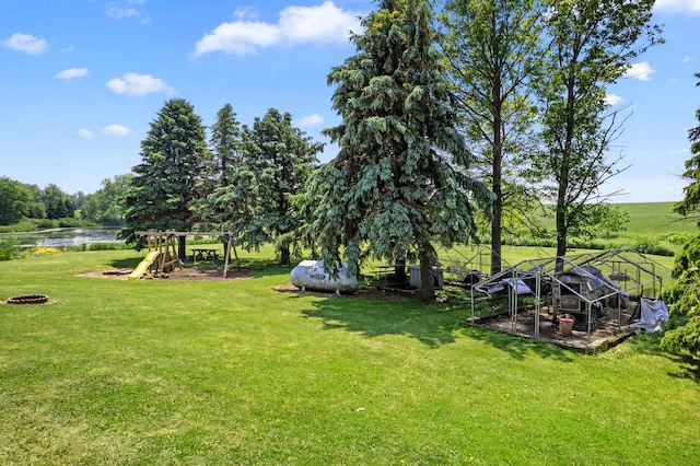 2365 Richardson Rd, West Brooklyn, IL 61378 - view of green lawn featuring a water view and a playground