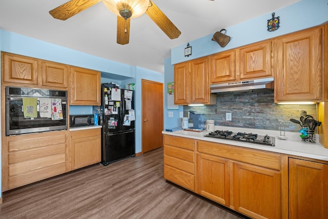 2365 Richardson Rd, West Brooklyn, IL 61378 - kitchen with black appliances, under cabinet range hood, light countertops, and light wood finished floors