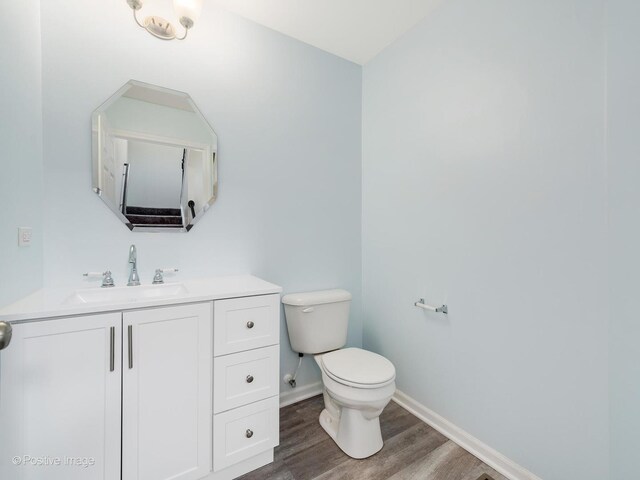 14017 S Belmont Dr, Homer Glen, IL 60491 - bathroom featuring toilet, wood finished floors, baseboards, and vanity