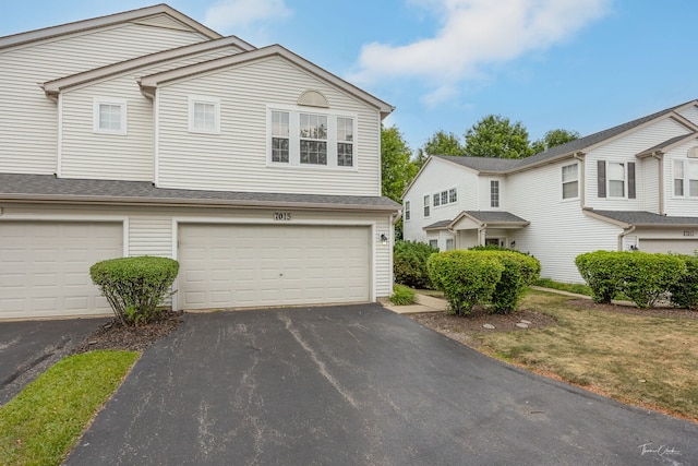 7015 Clearwater Dr Unit 7015, Plainfield, IL 60586 - traditional-style home with asphalt driveway and an attached garage