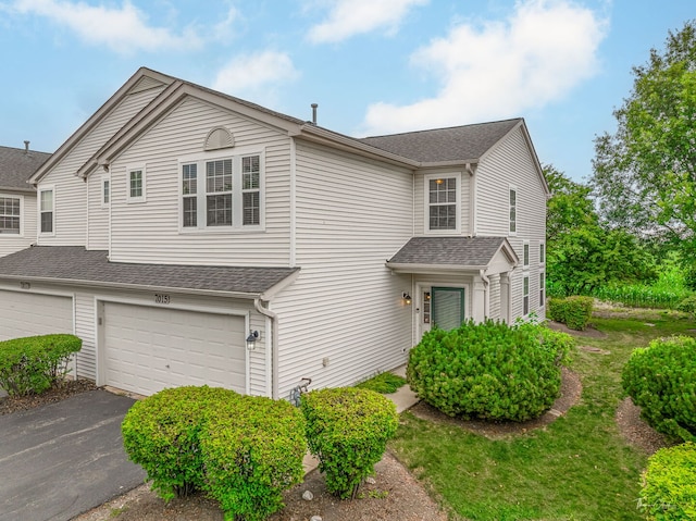 7015 Clearwater Dr Unit 7015, Plainfield, IL 60586 - traditional-style house featuring a garage, driveway, and roof with shingles