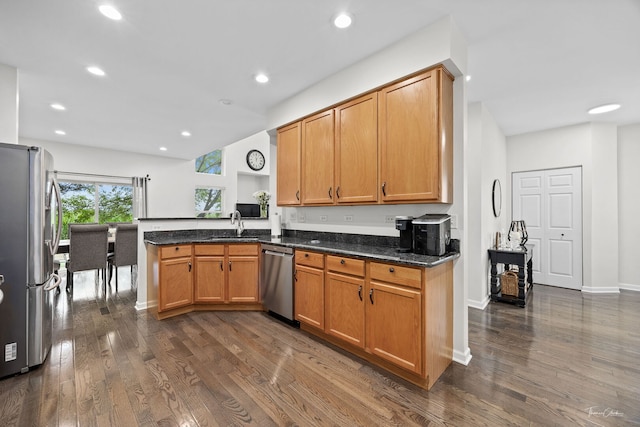 7015 Clearwater Dr Unit 7015, Plainfield, IL 60586 - kitchen featuring stainless steel appliances, dark wood-type flooring, a peninsula, recessed lighting, and dark stone counters