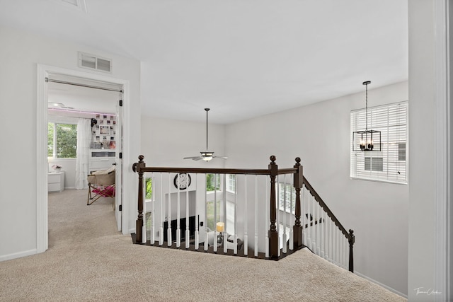 7015 Clearwater Dr Unit 7015, Plainfield, IL 60586 - corridor featuring an upstairs landing, carpet flooring, and a chandelier