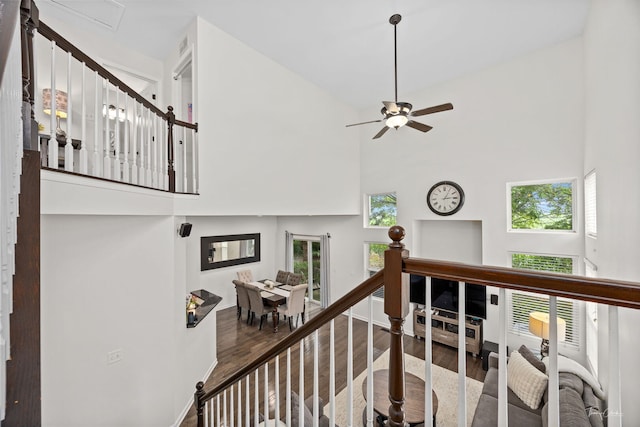 7015 Clearwater Dr Unit 7015, Plainfield, IL 60586 - stairs featuring wood finished floors, a towering ceiling, healthy amount of natural light, and a ceiling fan