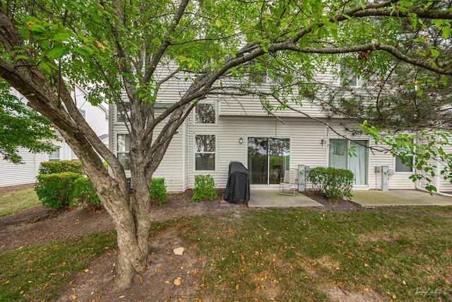 7015 Clearwater Dr Unit 7015, Plainfield, IL 60586 - back of property featuring a patio area and a lawn