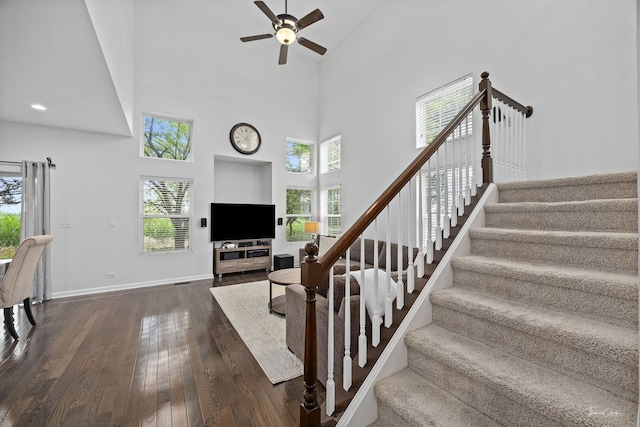 7015 Clearwater Dr Unit 7015, Plainfield, IL 60586 - stairway featuring high vaulted ceiling, ceiling fan, and hardwood / wood-style floors