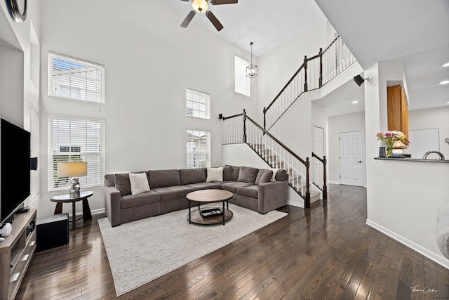7015 Clearwater Dr Unit 7015, Plainfield, IL 60586 - living area featuring stairs, a high ceiling, dark wood-style floors, ceiling fan, and healthy amount of natural light