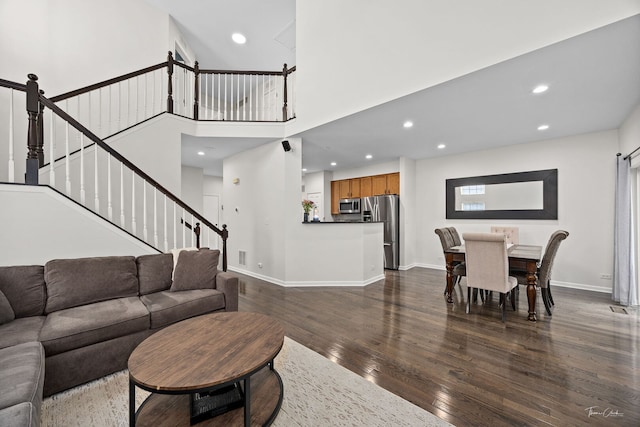 7015 Clearwater Dr Unit 7015, Plainfield, IL 60586 - living area with dark wood-style flooring, recessed lighting, stairs, and a high ceiling