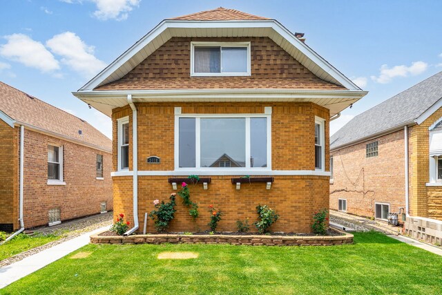3408 S 58th Ave, Cicero, IL 60804 - view of front of property featuring a front lawn, brick siding, and roof with shingles