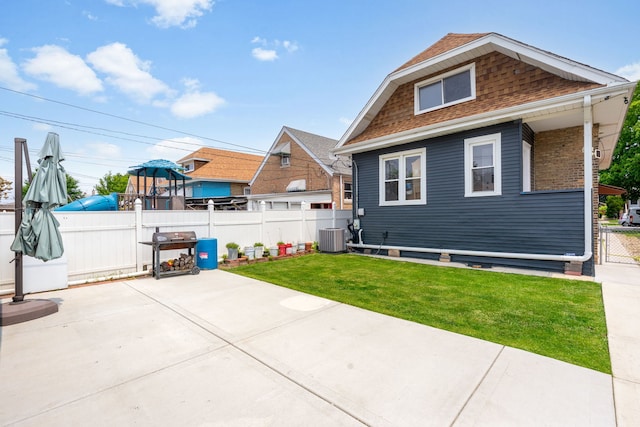 3408 S 58th Ave, Cicero, IL 60804 - rear view of house featuring a patio area and a shingled roof