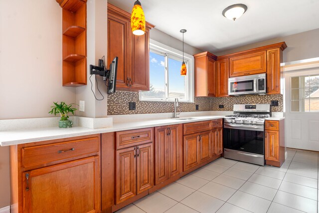 3408 S 58th Ave, Cicero, IL 60804 - kitchen with appliances with stainless steel finishes, open shelves, decorative light fixtures, backsplash, and light countertops