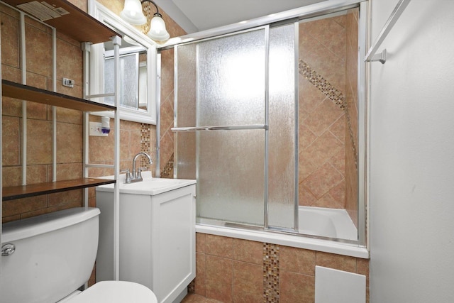 4014 W 77th Pl, Chicago, IL 60652 - bathroom featuring toilet, tiled shower / bath, vanity, and tile walls