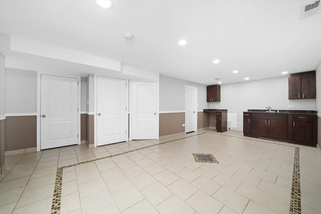 4014 W 77th Pl, Chicago, IL 60652 - below grade area with baseboards, recessed lighting, light tile patterned flooring, and a sink