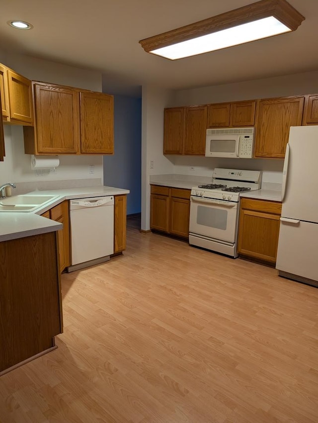 21359 W Sycamore Dr, Plainfield, IL 60544 - kitchen featuring white appliances, recessed lighting, light wood-style floors, brown cabinetry, and light countertops