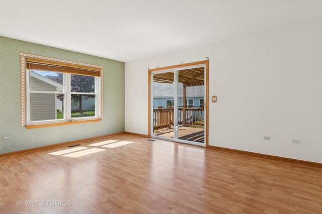 21359 W Sycamore Dr, Plainfield, IL 60544 - empty room featuring light wood finished floors and baseboards