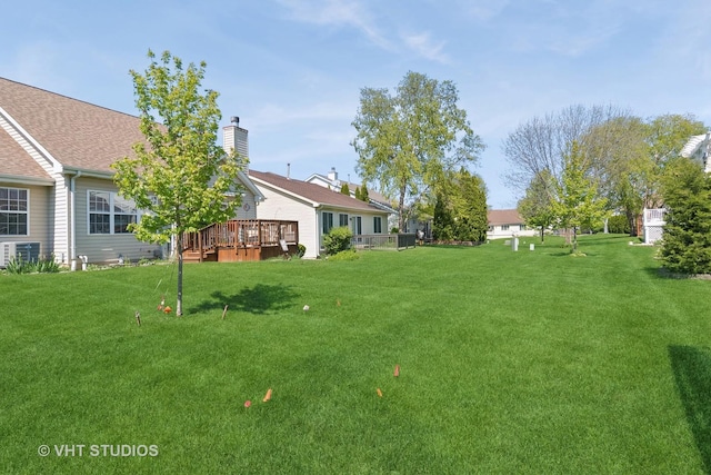 21359 W Sycamore Dr, Plainfield, IL 60544 - view of green lawn with a wooden deck and central AC unit