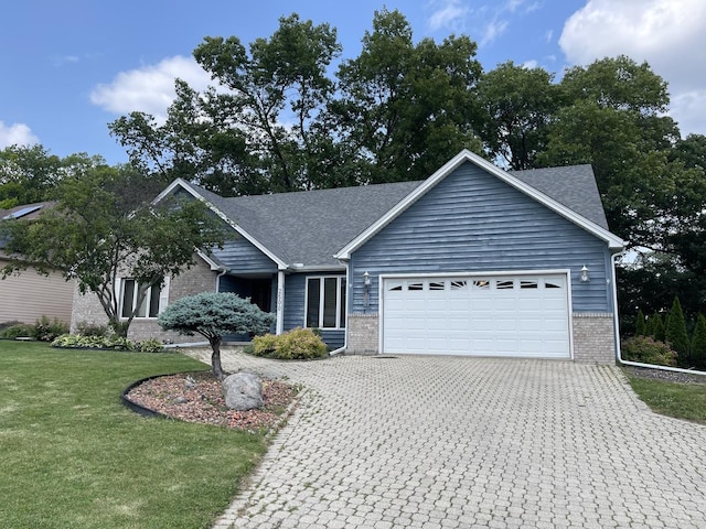 2500 Cherie Ln, Ottawa, IL 61350 - single story home featuring brick siding, an attached garage, decorative driveway, a front yard, and a shingled roof