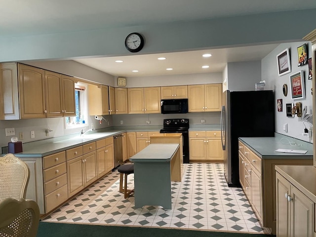 2500 Cherie Ln, Ottawa, IL 61350 - kitchen with black appliances, a breakfast bar area, light brown cabinetry, a kitchen island, and recessed lighting