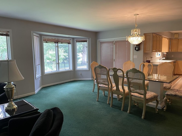 2500 Cherie Ln, Ottawa, IL 61350 - dining space featuring a chandelier, light colored carpet, and baseboards