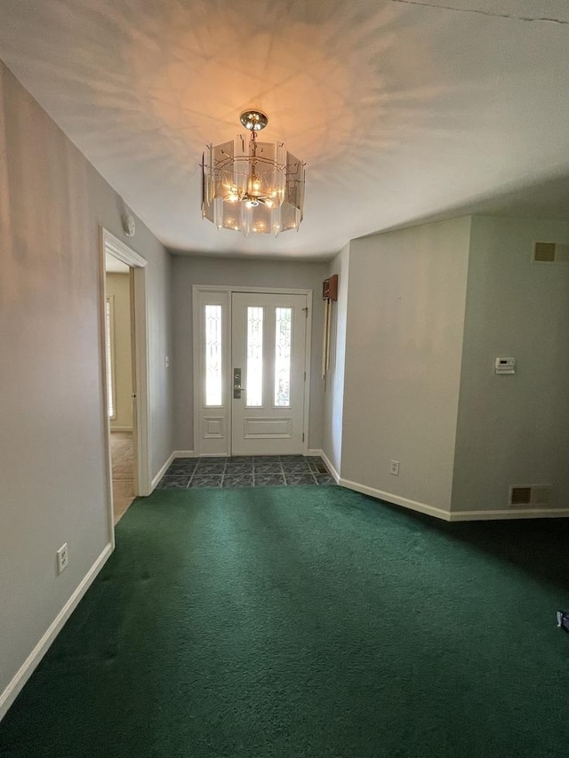 2500 Cherie Ln, Ottawa, IL 61350 - foyer entrance featuring a chandelier, dark carpet, and baseboards