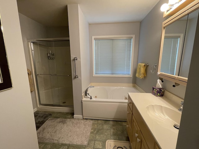 2500 Cherie Ln, Ottawa, IL 61350 - full bath with vanity, a stall shower, a jetted tub, and baseboards