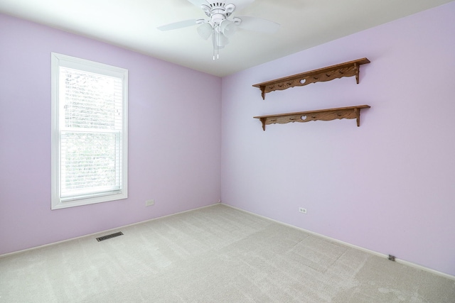 736 73rd St Unit 0, Downers Grove, IL 60516 - empty room with light carpet and a ceiling fan