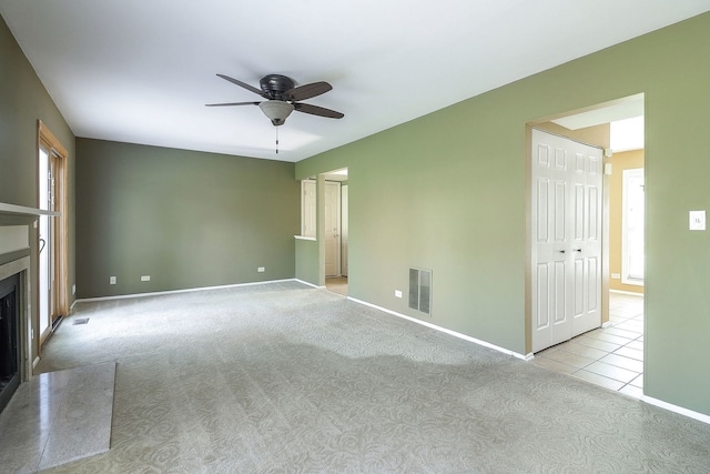736 73rd St Unit 0, Downers Grove, IL 60516 - unfurnished living room with a ceiling fan, carpet flooring, and a fireplace with flush hearth