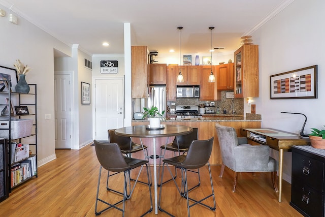 1355 W Washington Blvd Unit 4A, Chicago, IL 60607 - kitchen featuring brown cabinets, stainless steel appliances, decorative backsplash, light wood-style floors, and glass insert cabinets