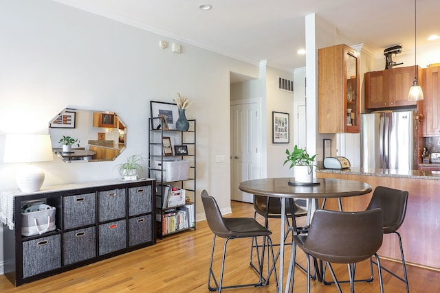 1355 W Washington Blvd Unit 4A, Chicago, IL 60607 - dining space with crown molding, light wood-type flooring, and recessed lighting