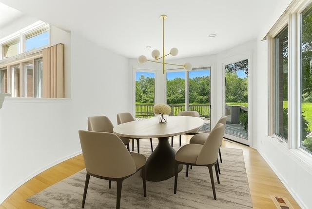 2471 Augusta Way, Highland Park, IL 60035 - dining area featuring plenty of natural light, a chandelier, and light wood finished floors