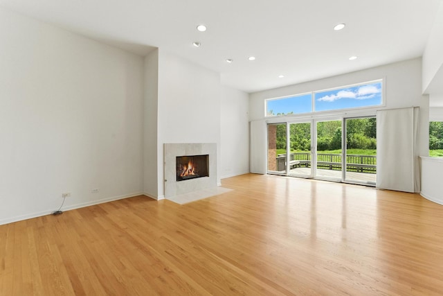 2471 Augusta Way, Highland Park, IL 60035 - unfurnished living room featuring recessed lighting, a high end fireplace, and light wood-style flooring