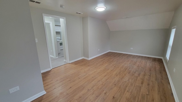 920 S Mcalister Ave, Waukegan, IL 60085 - bonus room featuring light wood-style flooring and lofted ceiling