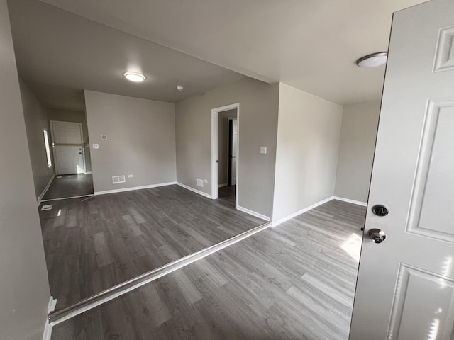 920 S Mcalister Ave, Waukegan, IL 60085 - spare room featuring wood finished floors and baseboards