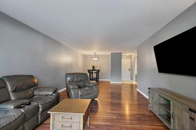263 S Clubhouse Dr Unit 126, Palatine, IL 60074 - living area featuring a chandelier and dark wood-style floors