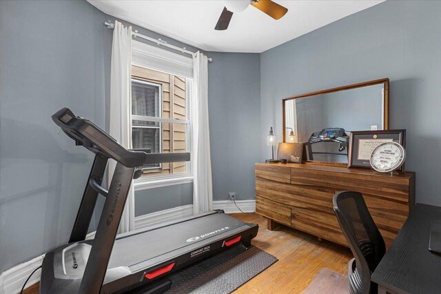 3828 N Wilton Ave, Chicago, IL 60613 - workout room featuring a ceiling fan, wood finished floors, plenty of natural light, and baseboards
