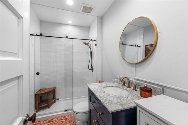3828 N Wilton Ave, Chicago, IL 60613 - bathroom featuring vanity, toilet, a shower stall, and recessed lighting