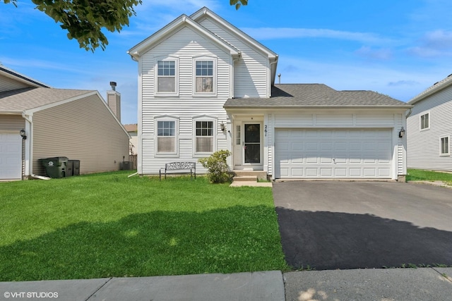 261 E Camden Ln, Round Lake Beach, IL 60073 - traditional-style home with driveway, an attached garage, a front lawn, and central air condition unit